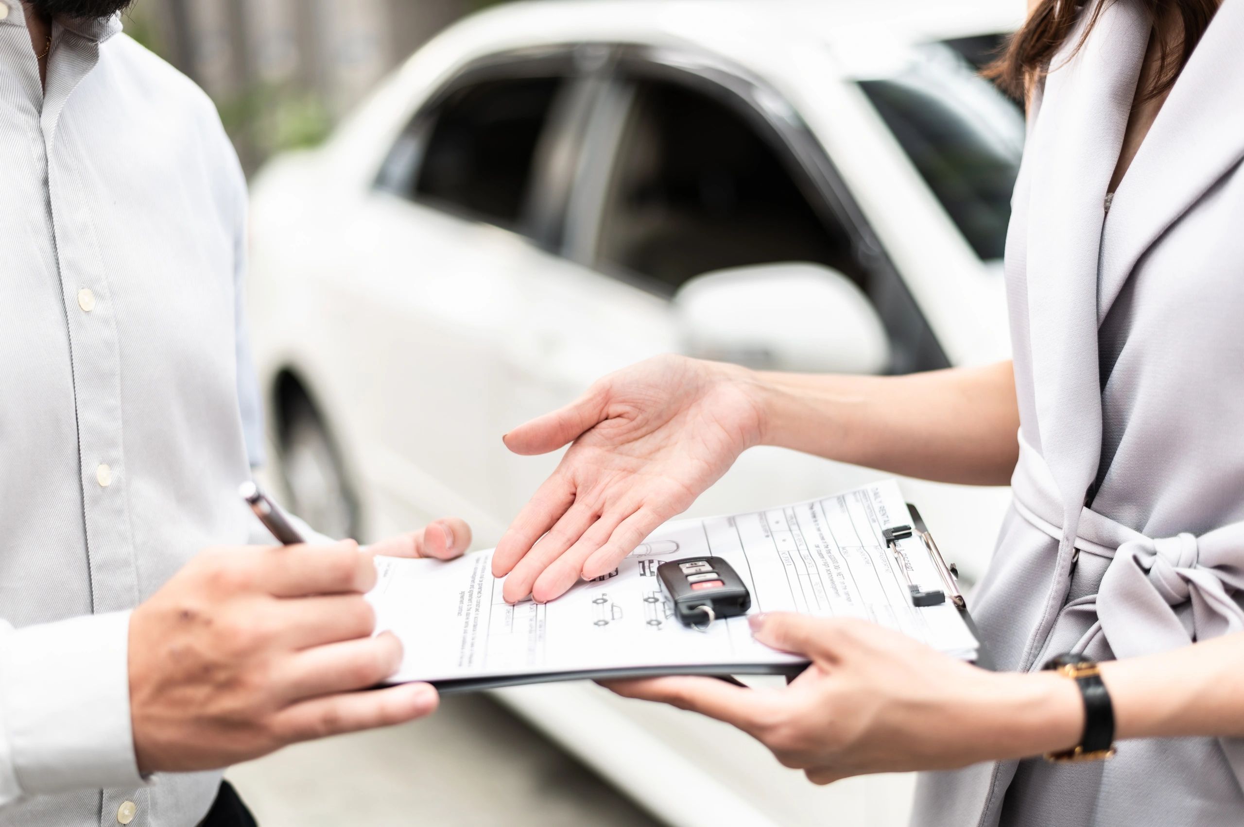 Business professional with a rented car